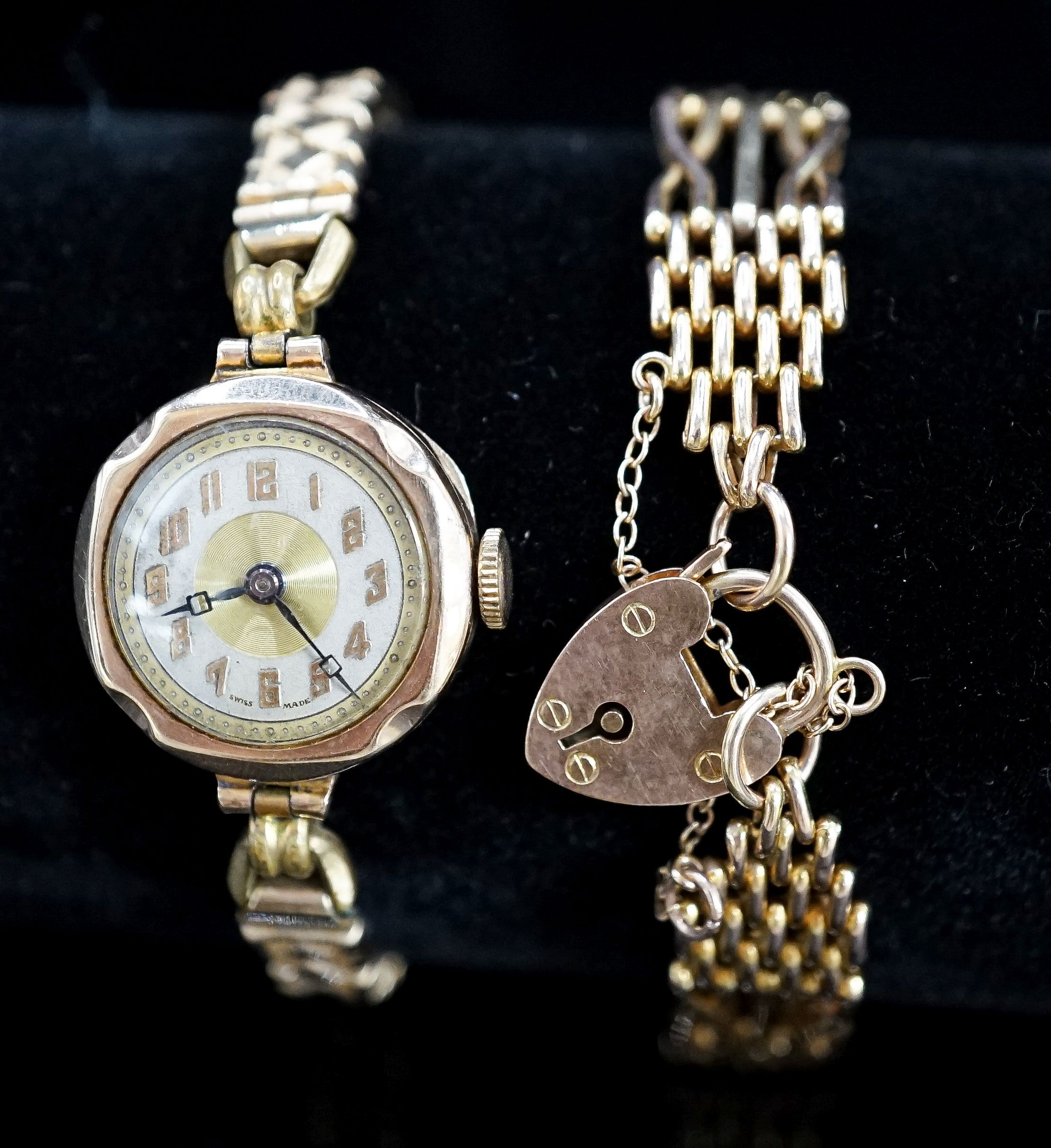 A 9ct. yellow gold chain bracelet, 9.7 grams and a lady's 9ct gold watch on a 9ct and metal core bracelet.